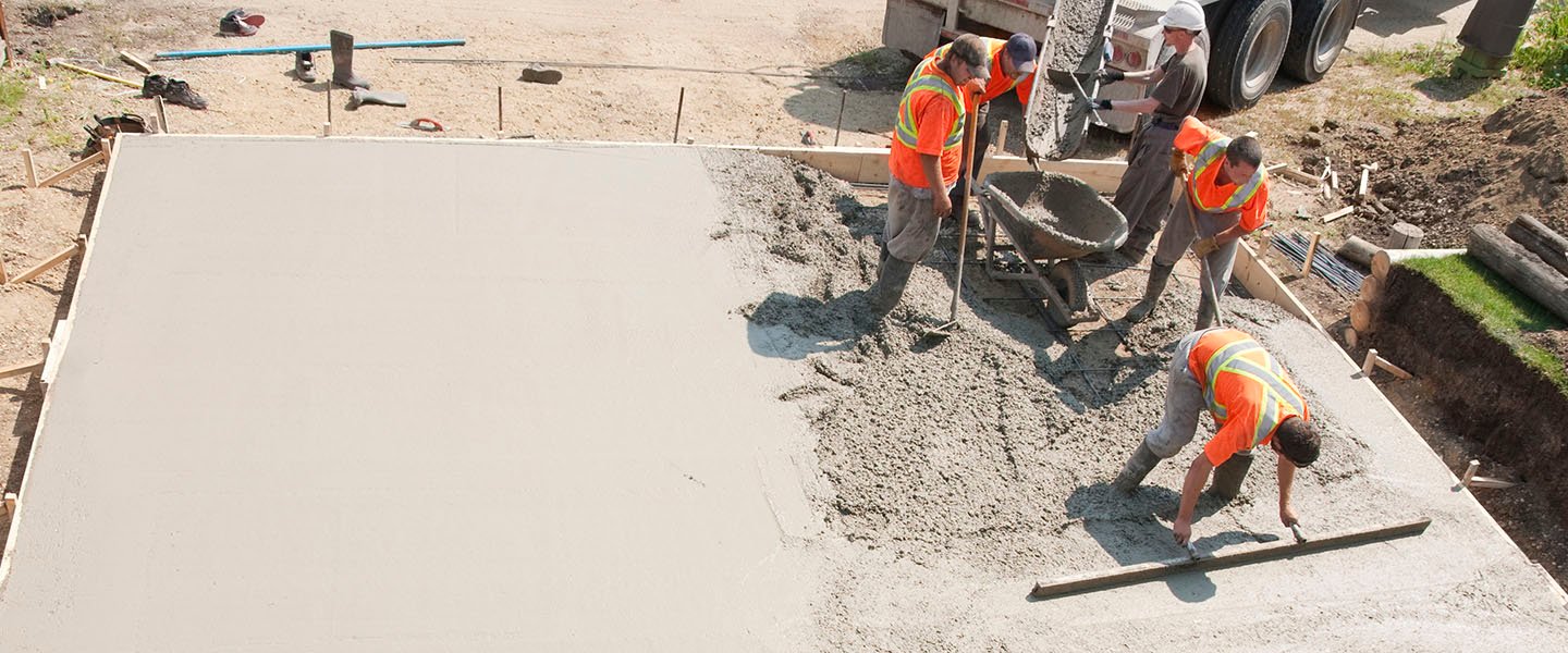 Crew pouring a concrete foundation